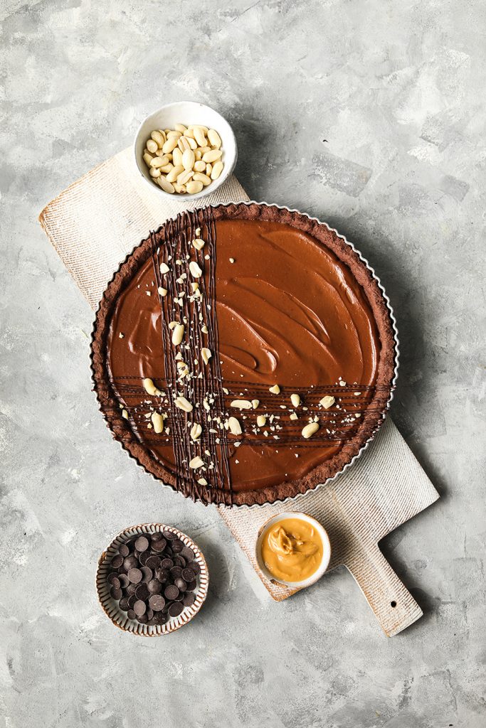This image has an empty alt attribute; its file name is Chocolate-Peanut-Butter-Tart-by-Luce-Hosier-1-683x1024.jpg