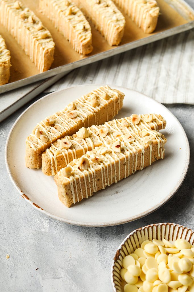 This image has an empty alt attribute; its file name is Hazelnut-White-Chocolate-Biscotti-2-683x1024.jpg